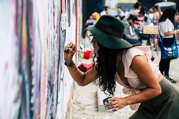 a girl painting on wall