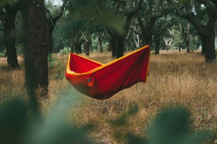 man setting up hammock